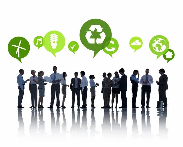 Business professionals discussing sustainable energy and recycling concepts.