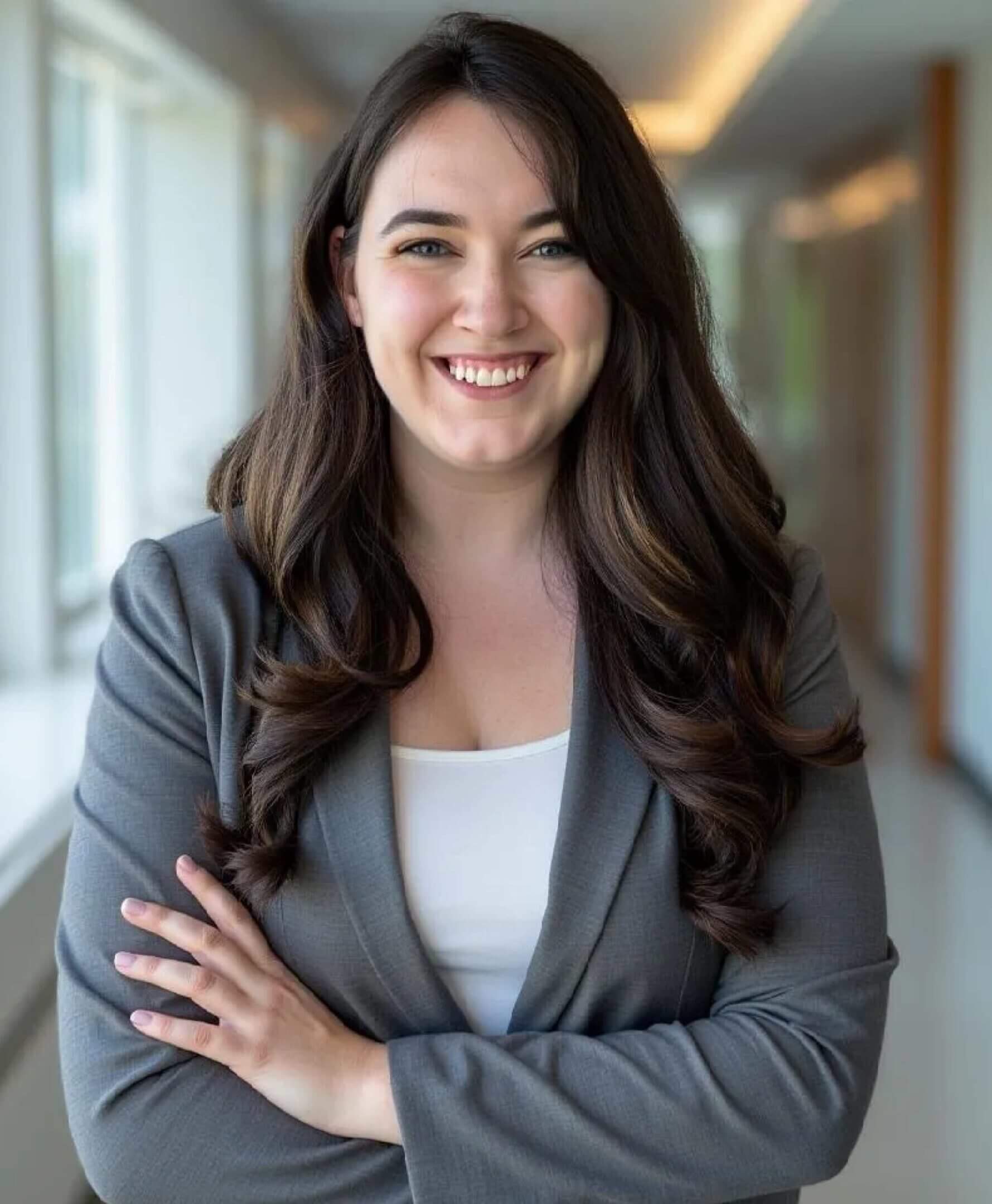 Smiling woman in a professional setting.