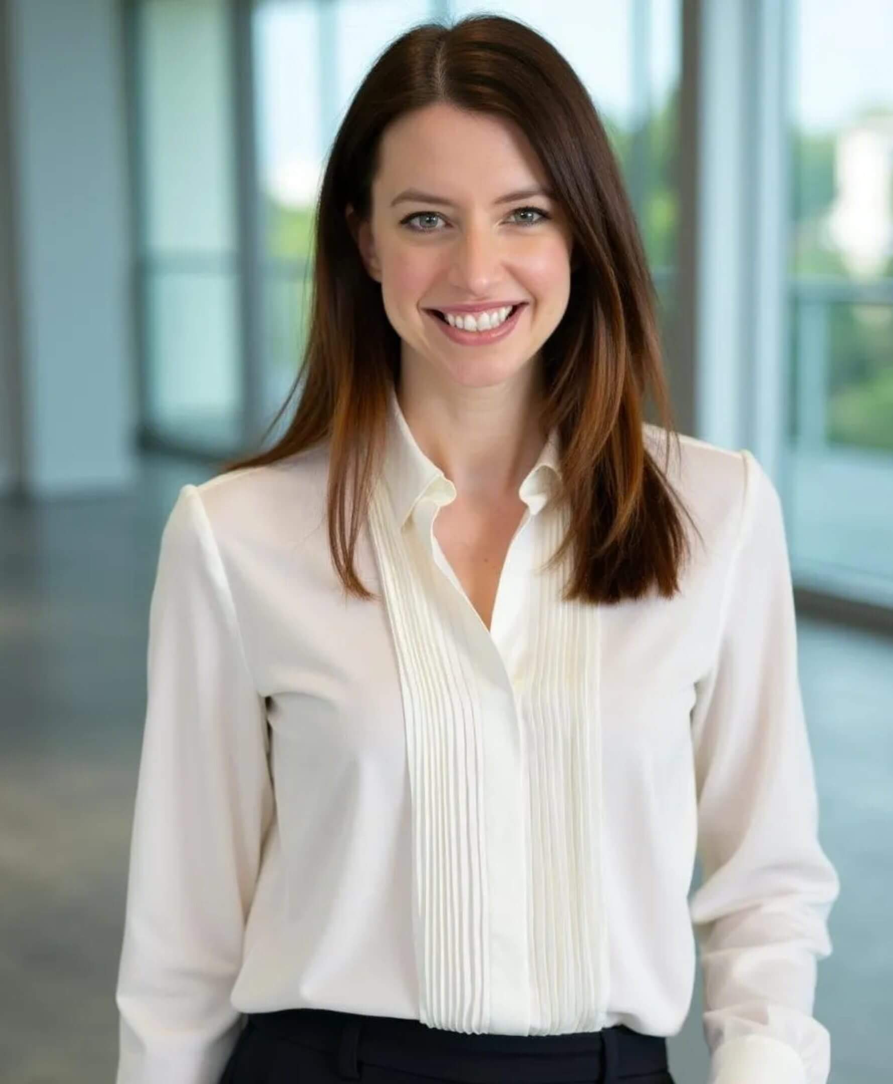 Smiling woman in a bright office.