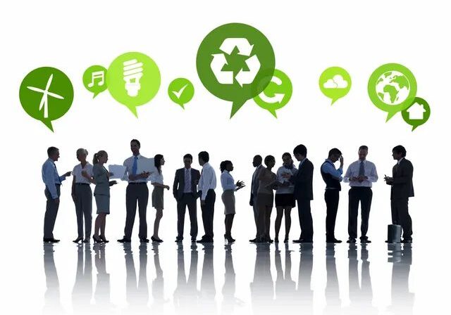 Business professionals discussing sustainable energy and recycling concepts.